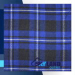 Ramsey Blue tartan fabric for sale showing vibrant modern dress sett pattern with royal blue white black checks, authentic Scottish wool textile by the yard