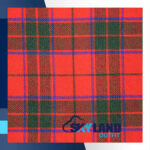 Scottish Rose tartan fabric for sale showing delicate pink base with green white orange overcheck pattern, soft romantic Scottish wool textile by the yard