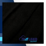 Solid black tartan fabric for sale showing subtle shadow weave texture on jet black Scottish wool, modern monochrome textile by the yard for contemporary kilts