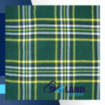 St. Patrick tartan fabric for sale showing green and gold sett pattern, Irish heritage Scottish wool textile by the yard for Celtic kilts and St. Patricks Day wear